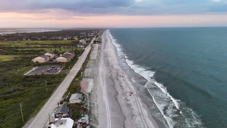 vilano beach coastline with long sandy shores, sea waves, and nearby residential areas