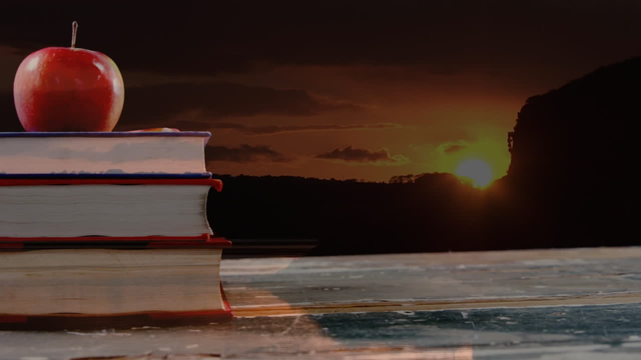 책의 애니메이션과 풍경 위의 사과
