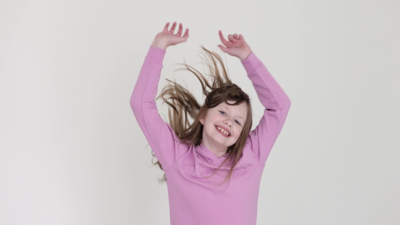 Happy Young Girl Jumping and Playing