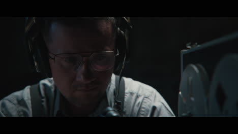 an intelligence officer listens to the wiretap recordings