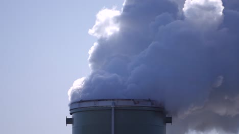 industrial factory plant pipes pollute the atmosphere, smokestack exhaust