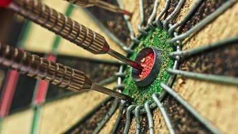 Three-darts-hit-the-target-of-a-dart-board