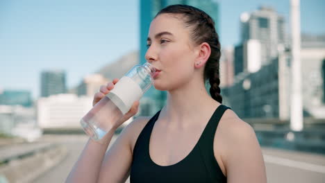 city, fitness and woman drinking water