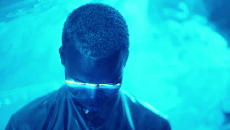 male fashion model in blue laser light