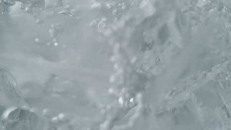 water stream pouring over ice cubes