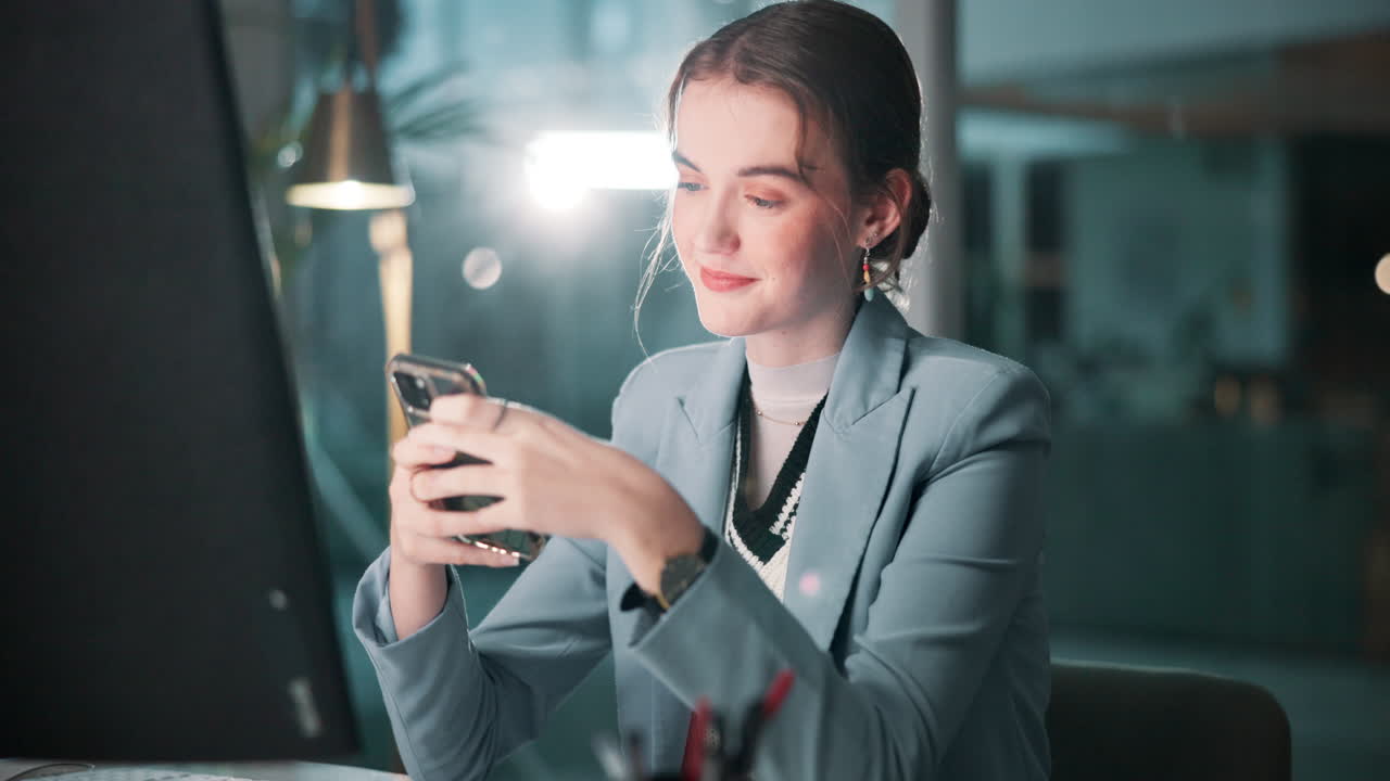 Woman using phone at desk
