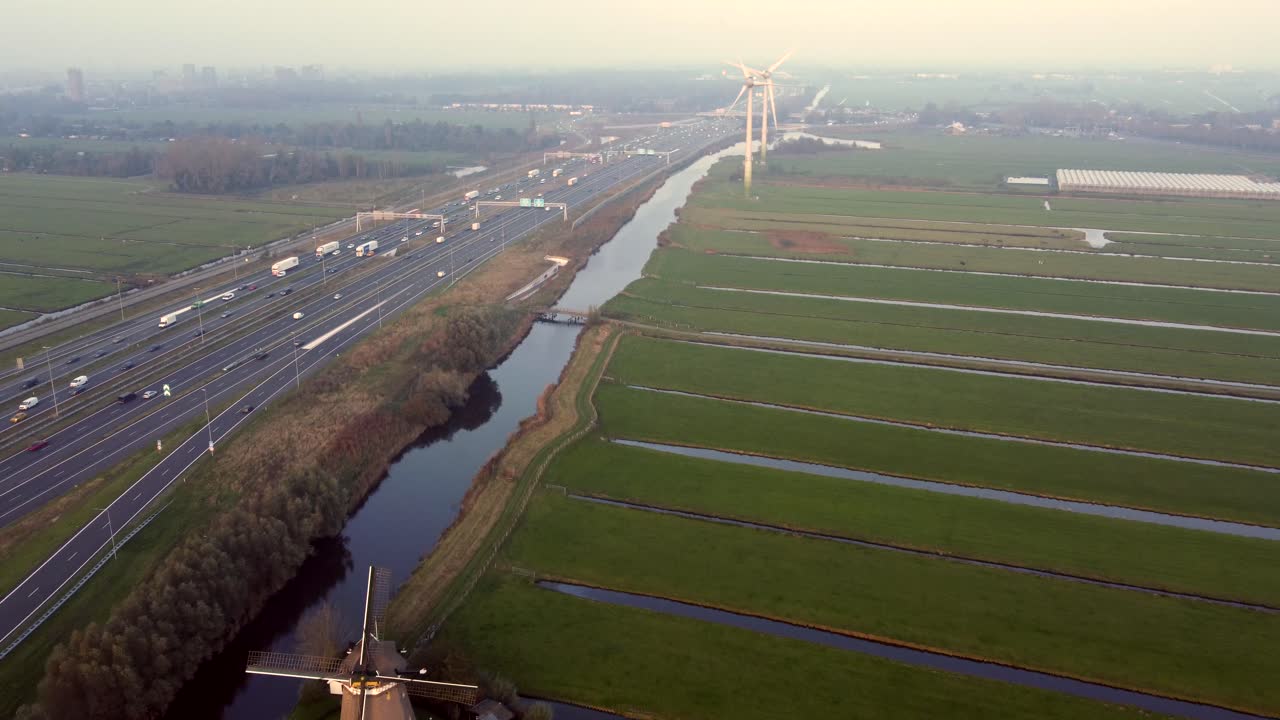Historic windmill, modern energy technology, transport infrastructure