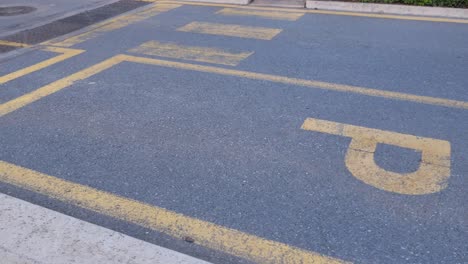 empty parking space with yellow lines