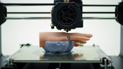 innovative 3d printing process captured: a close-up of a robotic hand being fabricated in a state-of-the-art 3d printer with precision