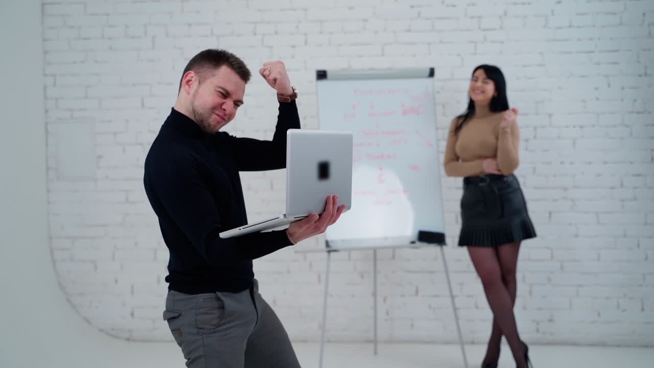 Young successful businessman. Successful businessman celebrating his victory