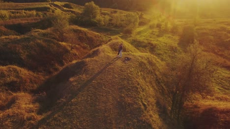 happy couple having fun outdoors. aerial shot of a beautiful young couple in love kiss in a nature