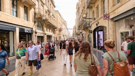 crowded street scene with pedestrians and shops