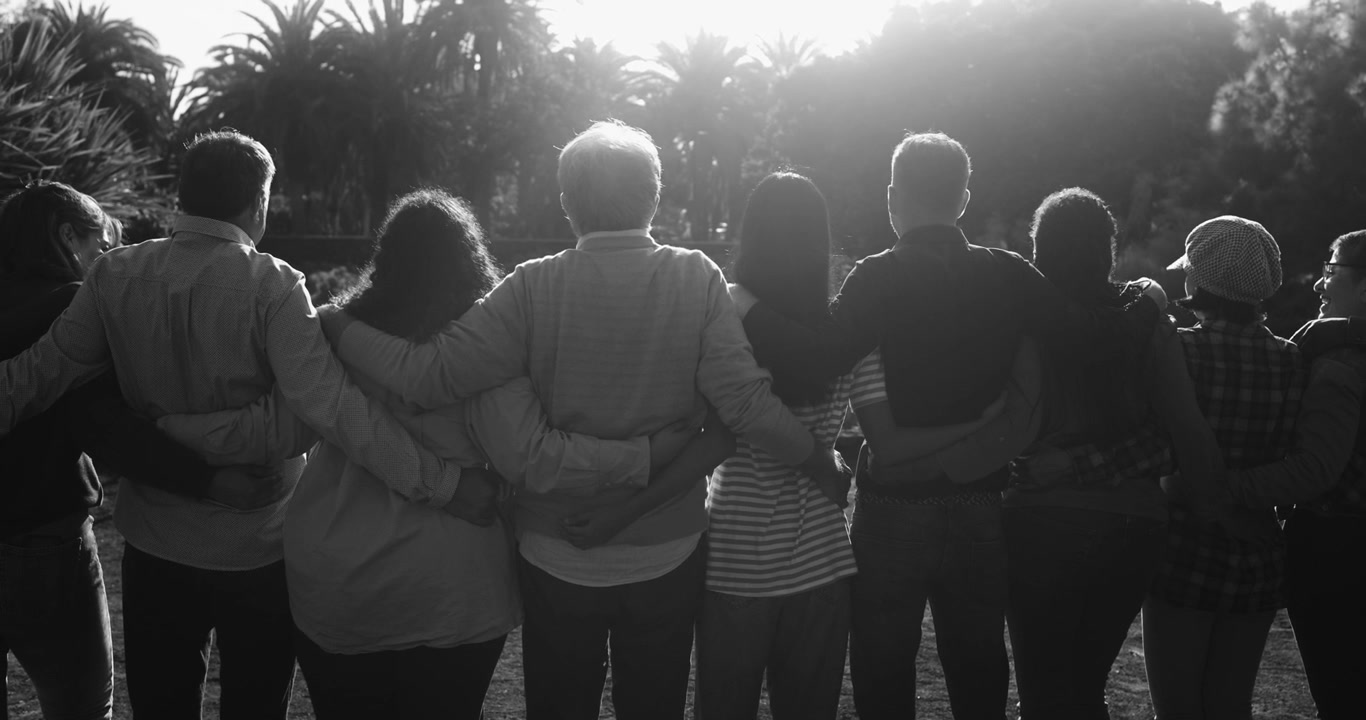 Backlit Silhouette of Diverse Group of People Standing Together