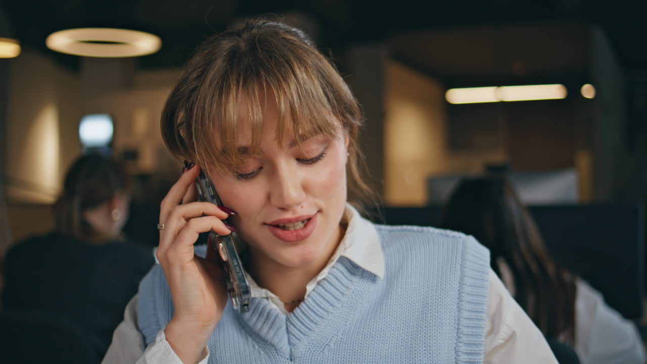 Smiling executive smartphone call in coworking office closeup. Woman speaking