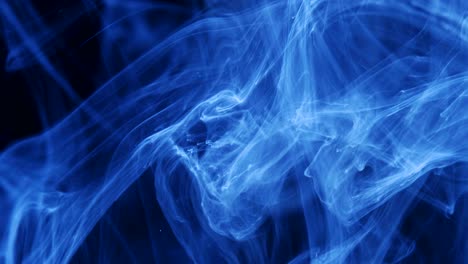 shot of ink moves. cosmic abstraction of a light blue particle ink. macro