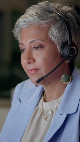 businesswoman wearing headset in office