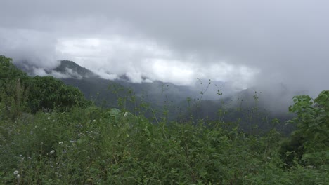 the mountains are covered with clouds
