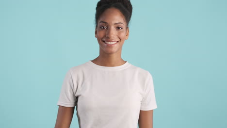 happy young woman waving her hand