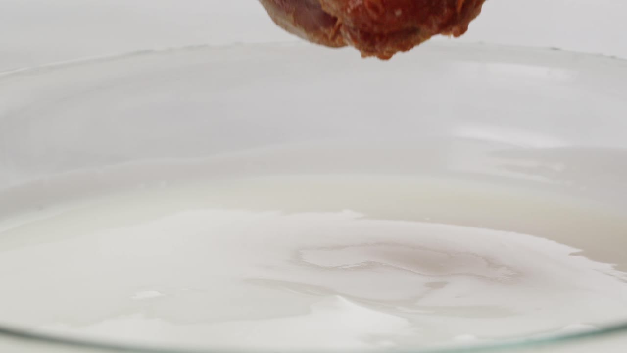 Dipping Fried Chicken Wing in Yogurt Sauce