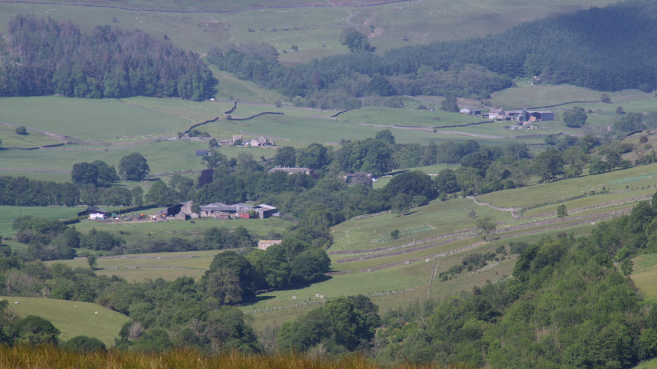 wide shot looking across the countryside and farmland to Skelton moor at Downholme and Downholme viewing point