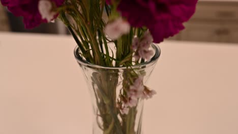 purple carnation floral arrangement in a vase, bottom to top scan