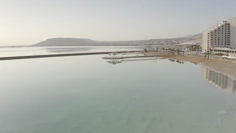 dead sea resort with hotel reflection