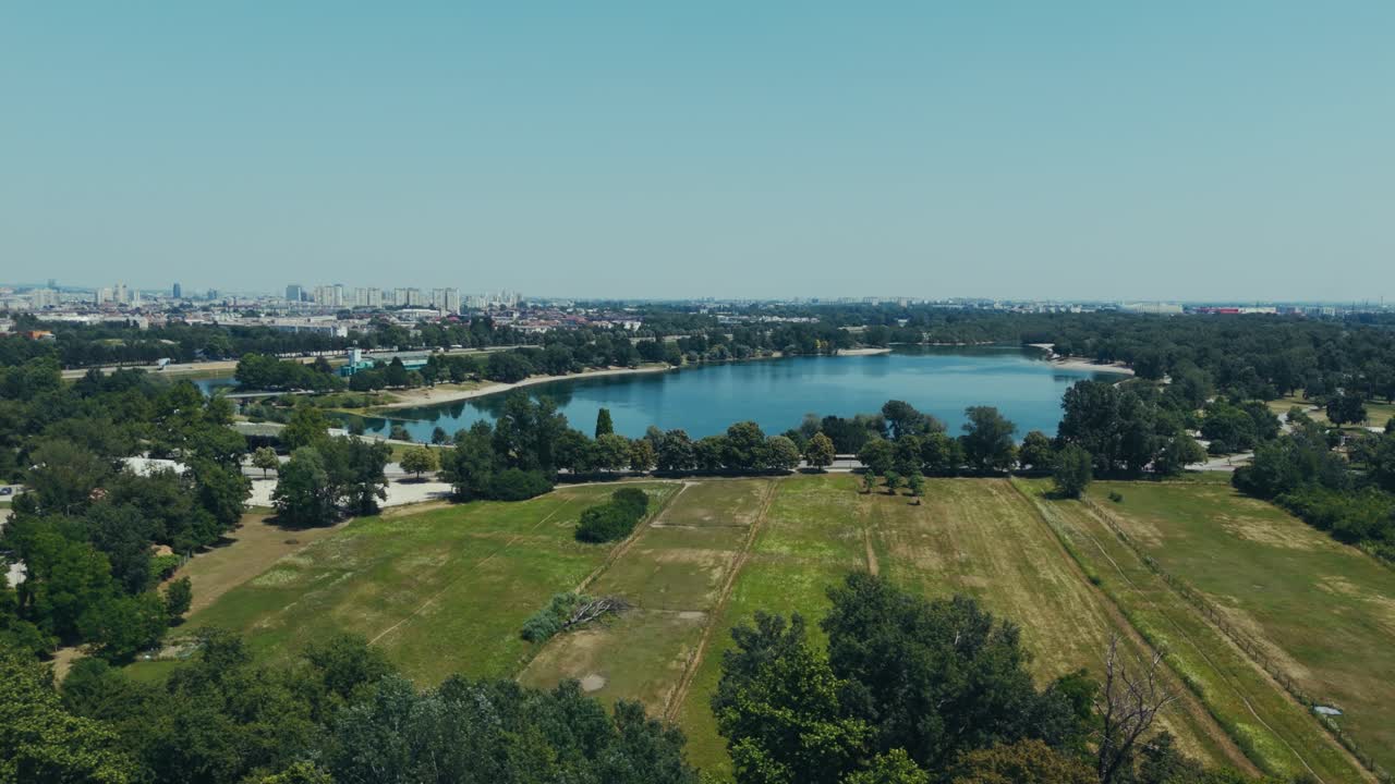blue lake glistens near Zagreb city with open meadows and forest edges
