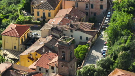 lorenzana, italy, featuring traditional terracotta-roofed houses in lush greenery, aerial view