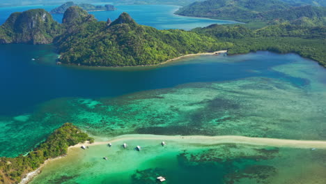 aerial view of tropical islands, turquoise waters, and sandbar