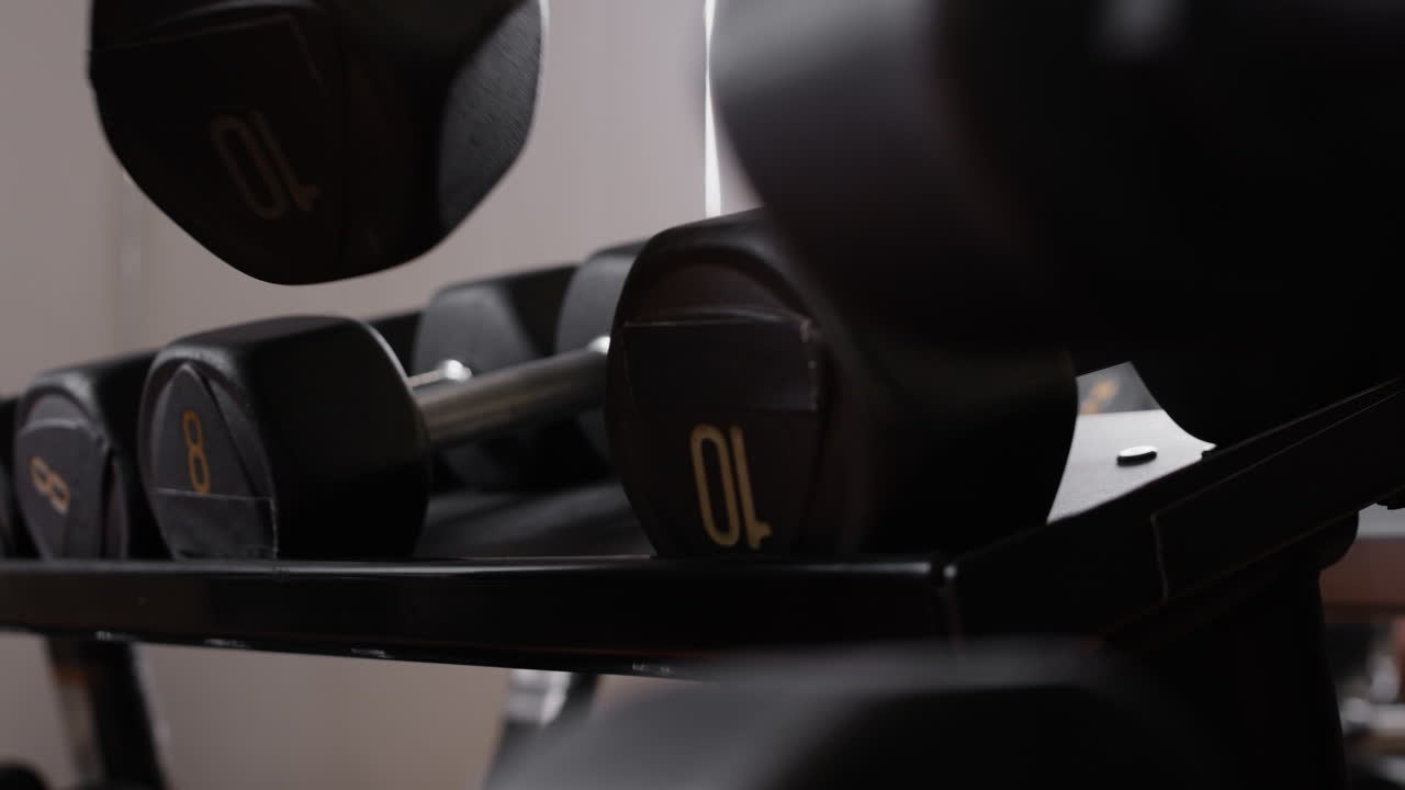 Dumbbells on a Rack in a Gym