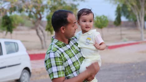 young-father-and-toddler-son-cute-moments-at-outdoor-at-evening