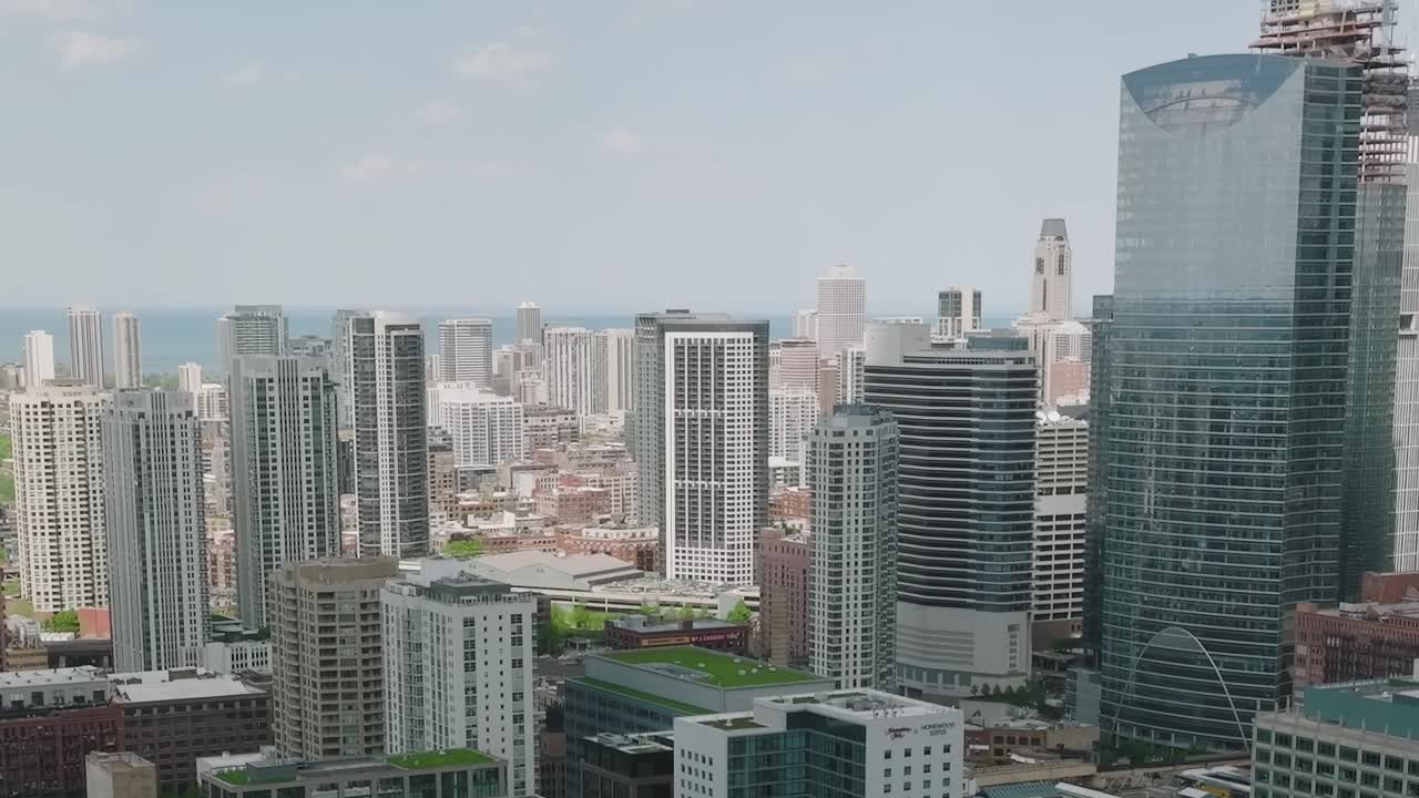 Aerial view of Chicago skyline with buildings and lake in the distance