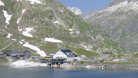 mountain resort next to alpine lake, in switzerland