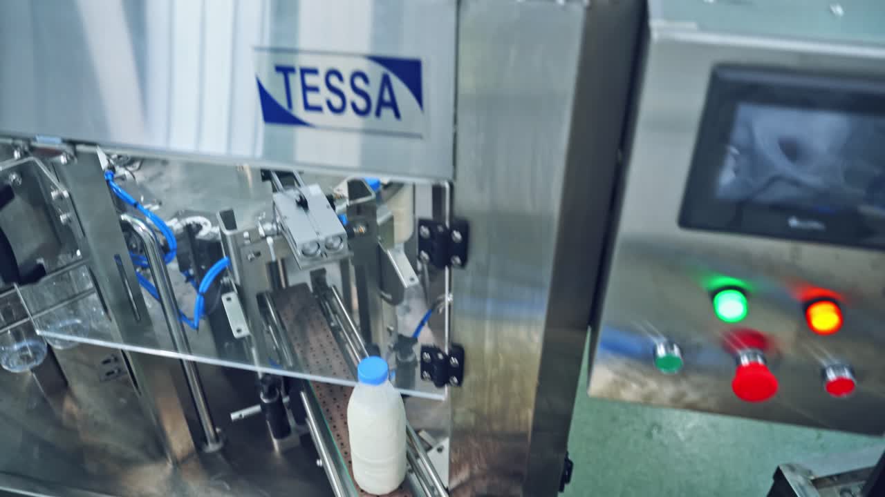 Conveyor with milk bottle. Packaging bottles line in the milk industry