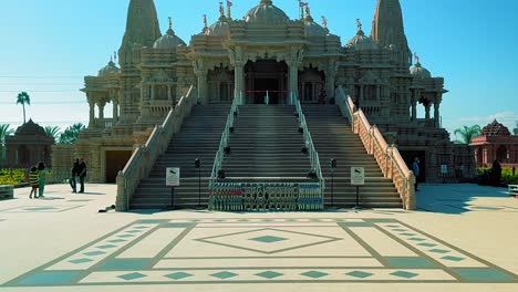 Panning-up-close-up-shot-of-the-front-of-the-BAPS-Shri-Swaminarayan-Mandir-Hindu-temple-in-Chino-California