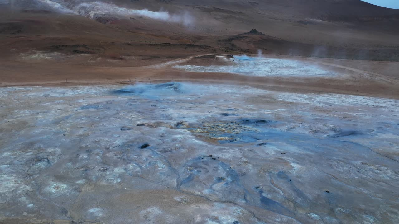 Hot geothermal area of hverir in Iceland during cloudy day. Boiling hot spring field in Europe. Aerial view