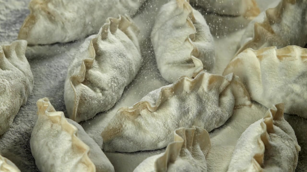 Close-up of Uncooked Dumplings Sprinkled with Flour