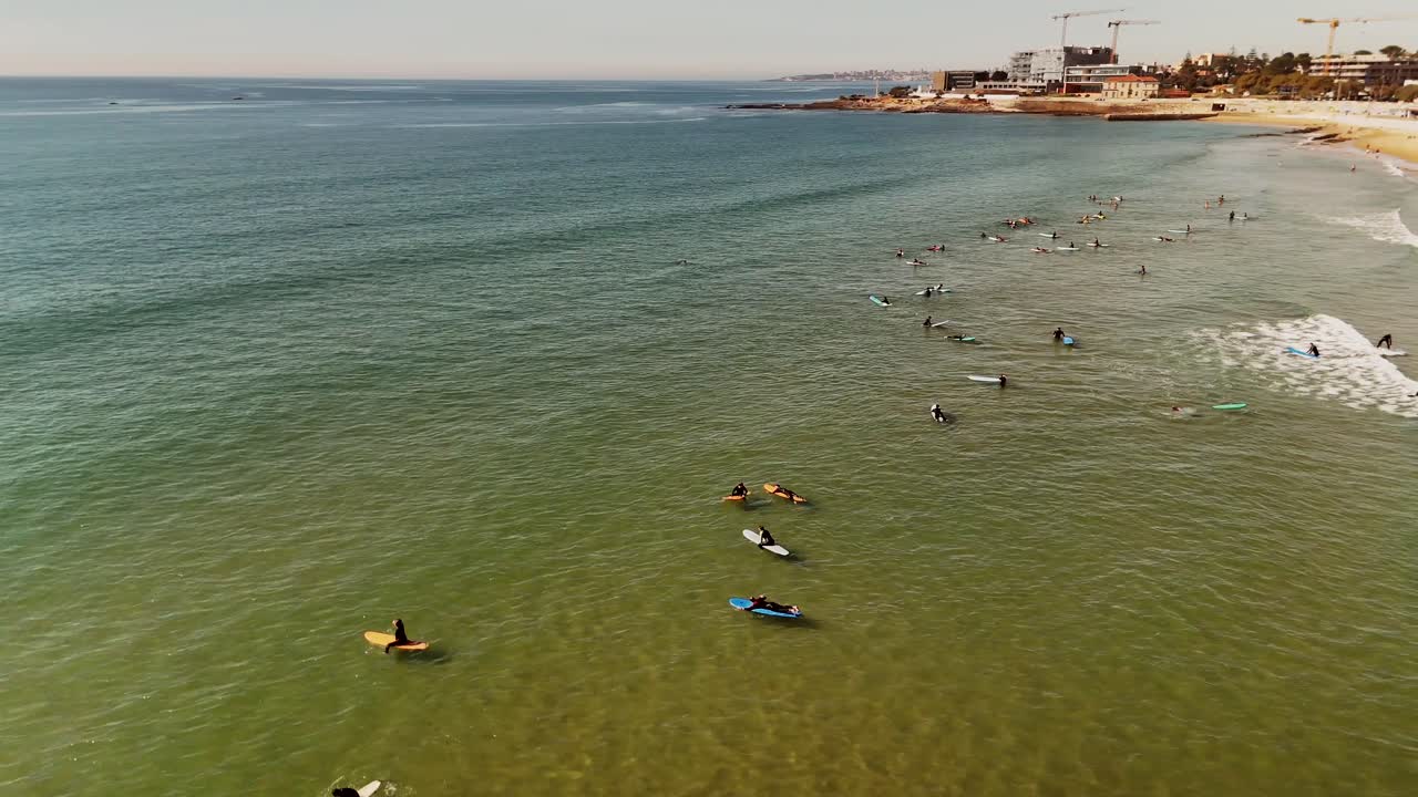 Aerial view of surfers on the ocean