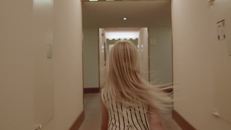 child running down a hotel hallway