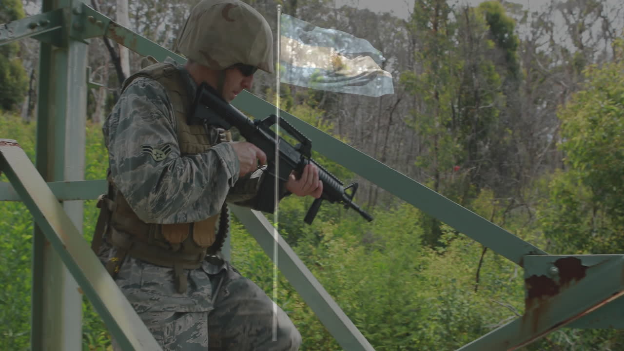 In camouflage gear, soldier descending metal stairs with rifle outside