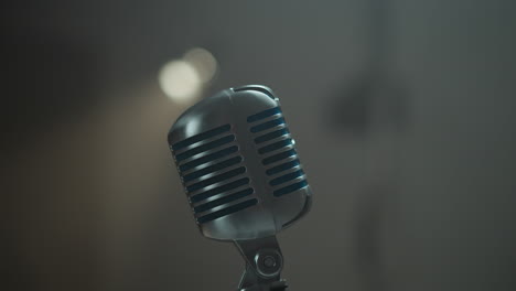 sophisticated vintage microphone elegantly isolated against a blurred background with dynamic camera movement