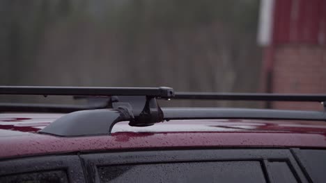 rain falling on suv car with roof rack