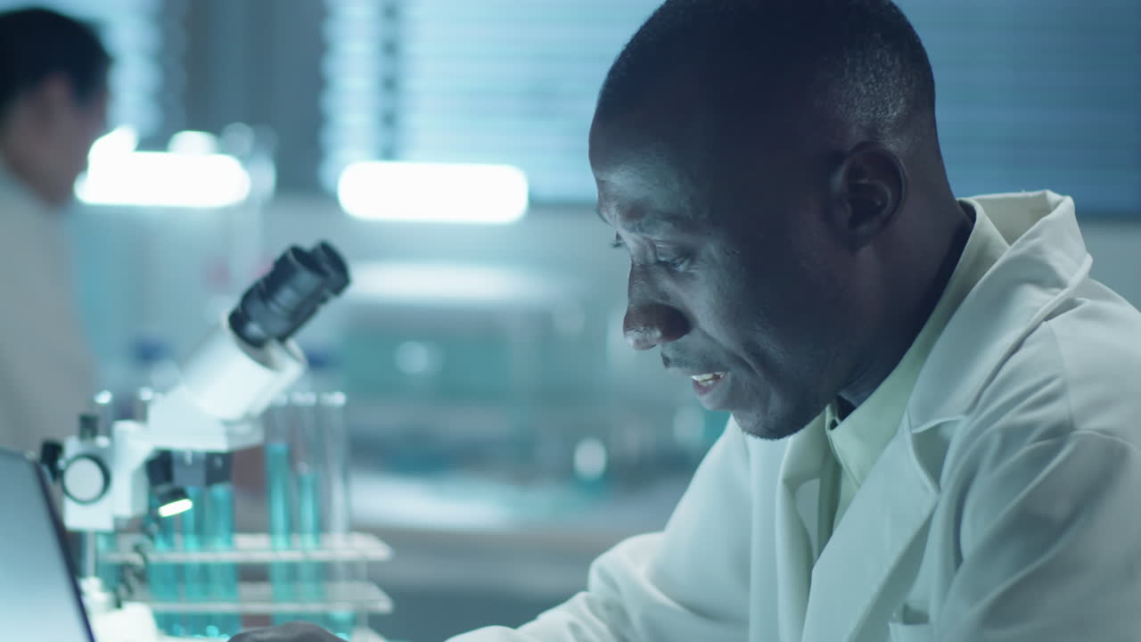 Diverse Colleagues Talking at Work in Laboratory