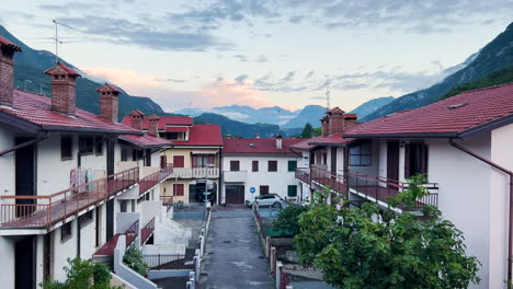 The-sun-rises-over-a-small-town-in-the-Italian-Alps