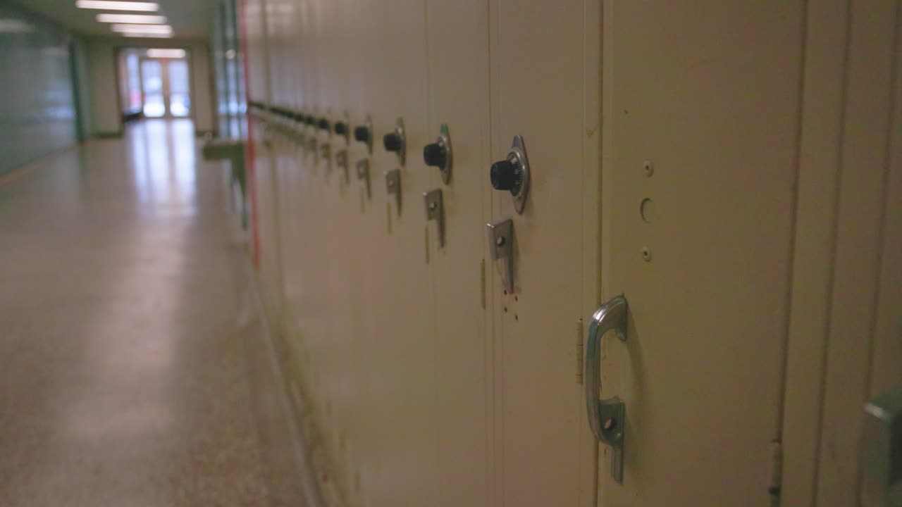 Extreme close up view of school lockers with gimbal video walking along.