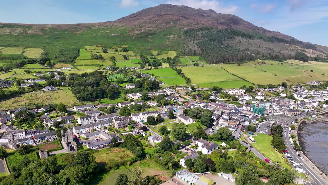 Carlingford charming town beside mountain, coastal scenery of Ireland, drone