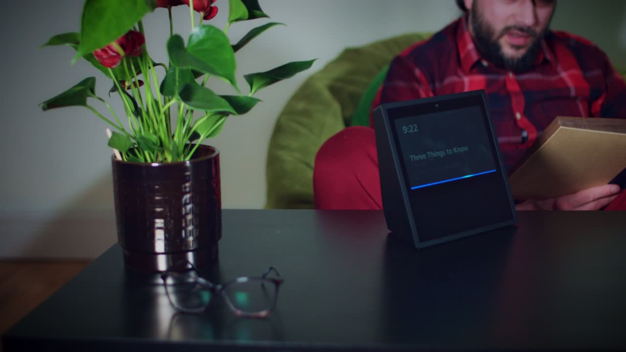 4k Young Man Asking Smart Home Device to Put Music On