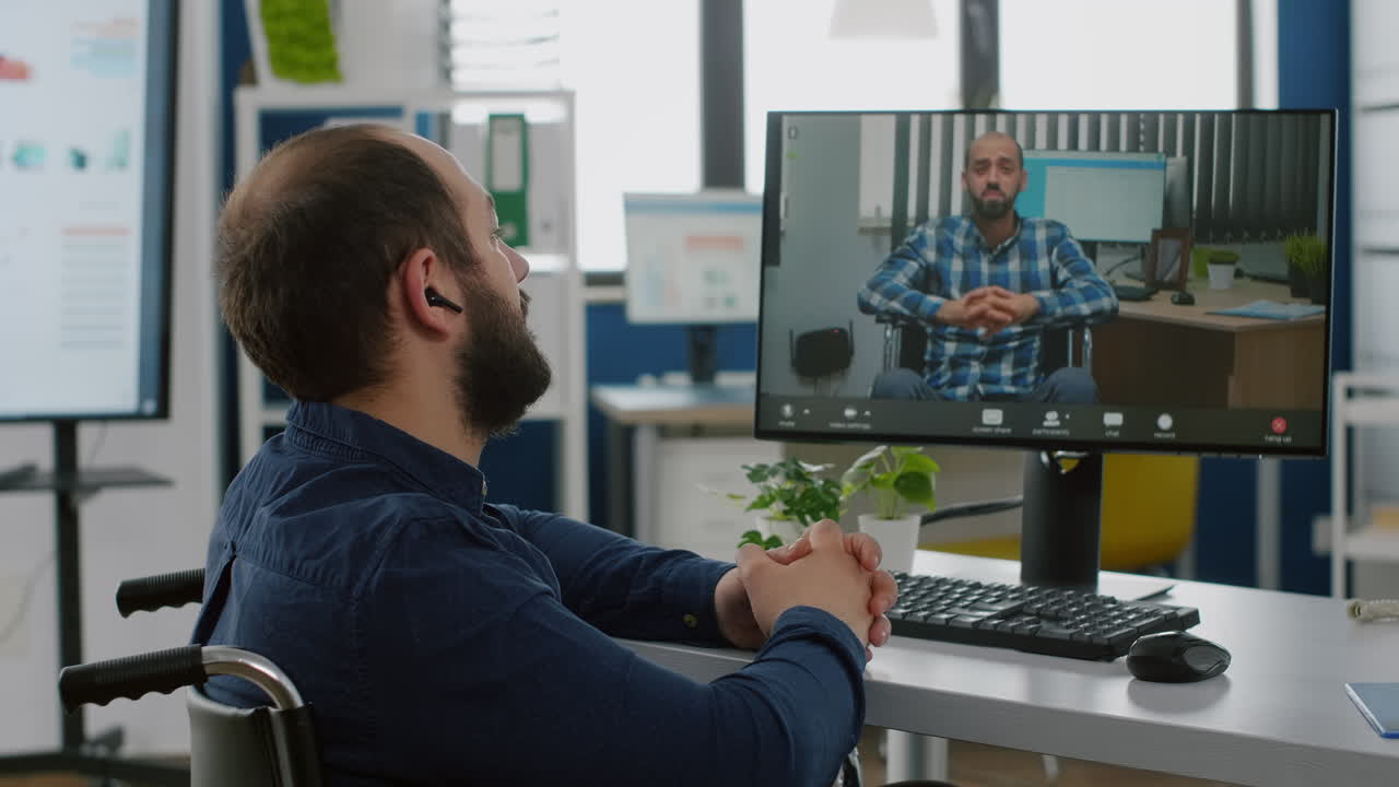 Invalid freelancer talking on videocall with remote coworker