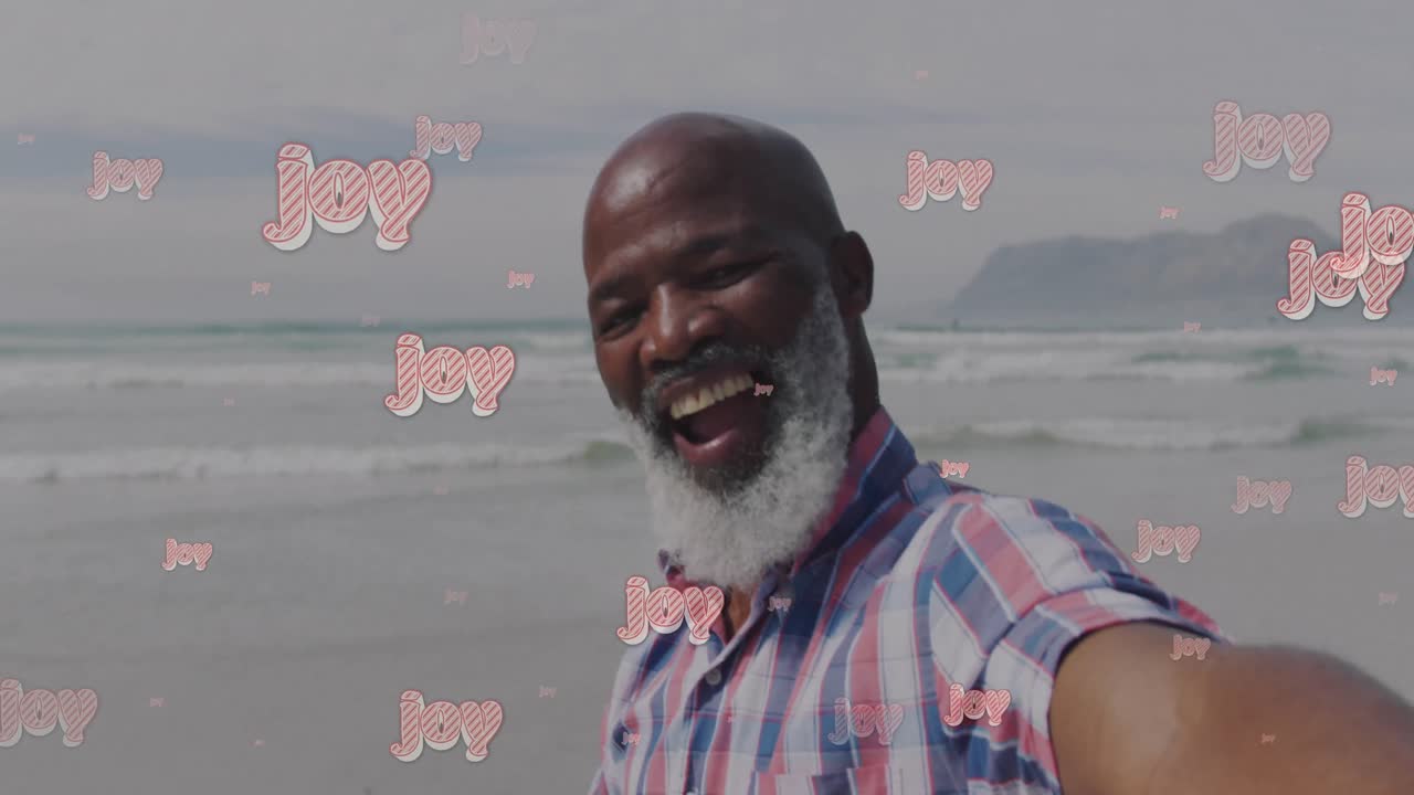 animación de felicitaciones de navidad texto sobre hombre afroamericano de alto nivel en la playa