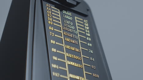 old fashioned mechanical metronome showing music tempo